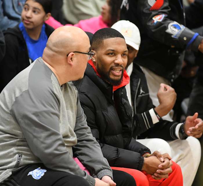 Oakland alum Damian Lillard (middle) was amongst a packed house Tuesday at Oakland Tech, which recorded its fourth win of the season against the Wildcats.